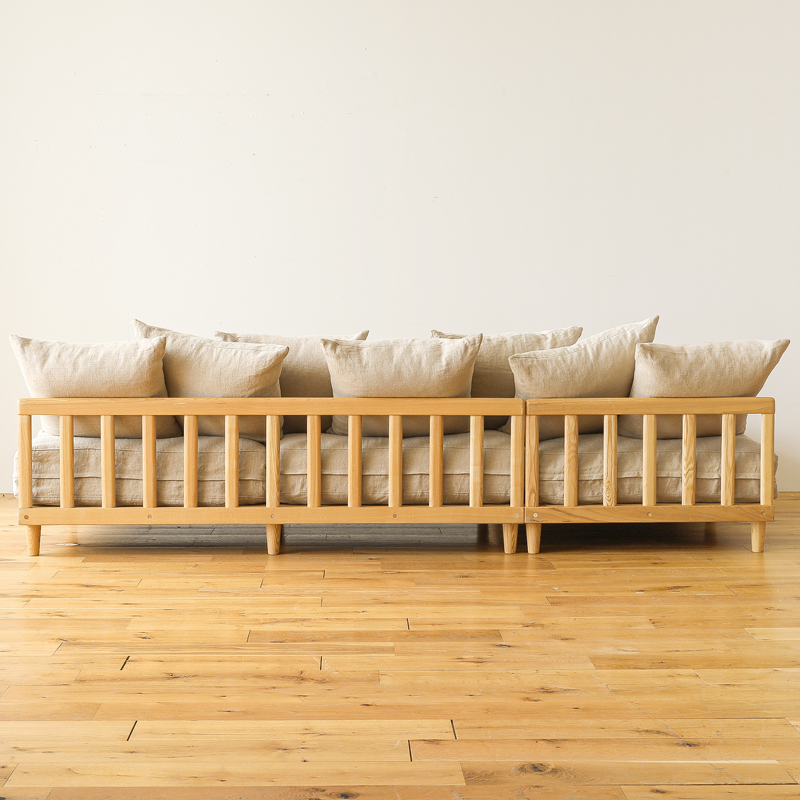 L shaped sofa in teak wood with cotton canvas cushions