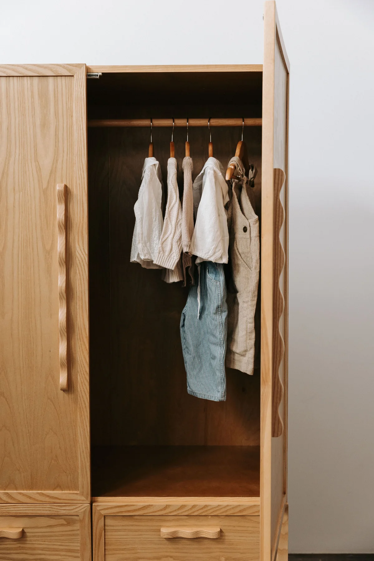 Minimalistic wardrobe in teak wood with natural finish