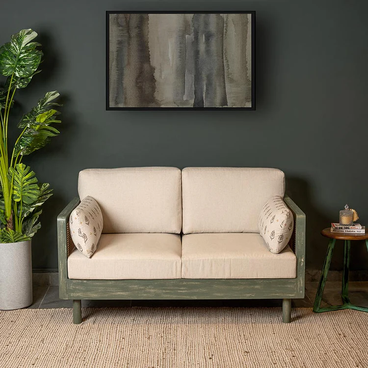Wood 2 seater sofa with rattan cane work in distress green finish