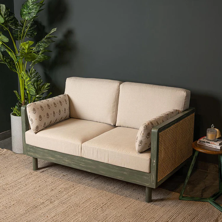 Wood 2 seater sofa with rattan cane work in distress green finish