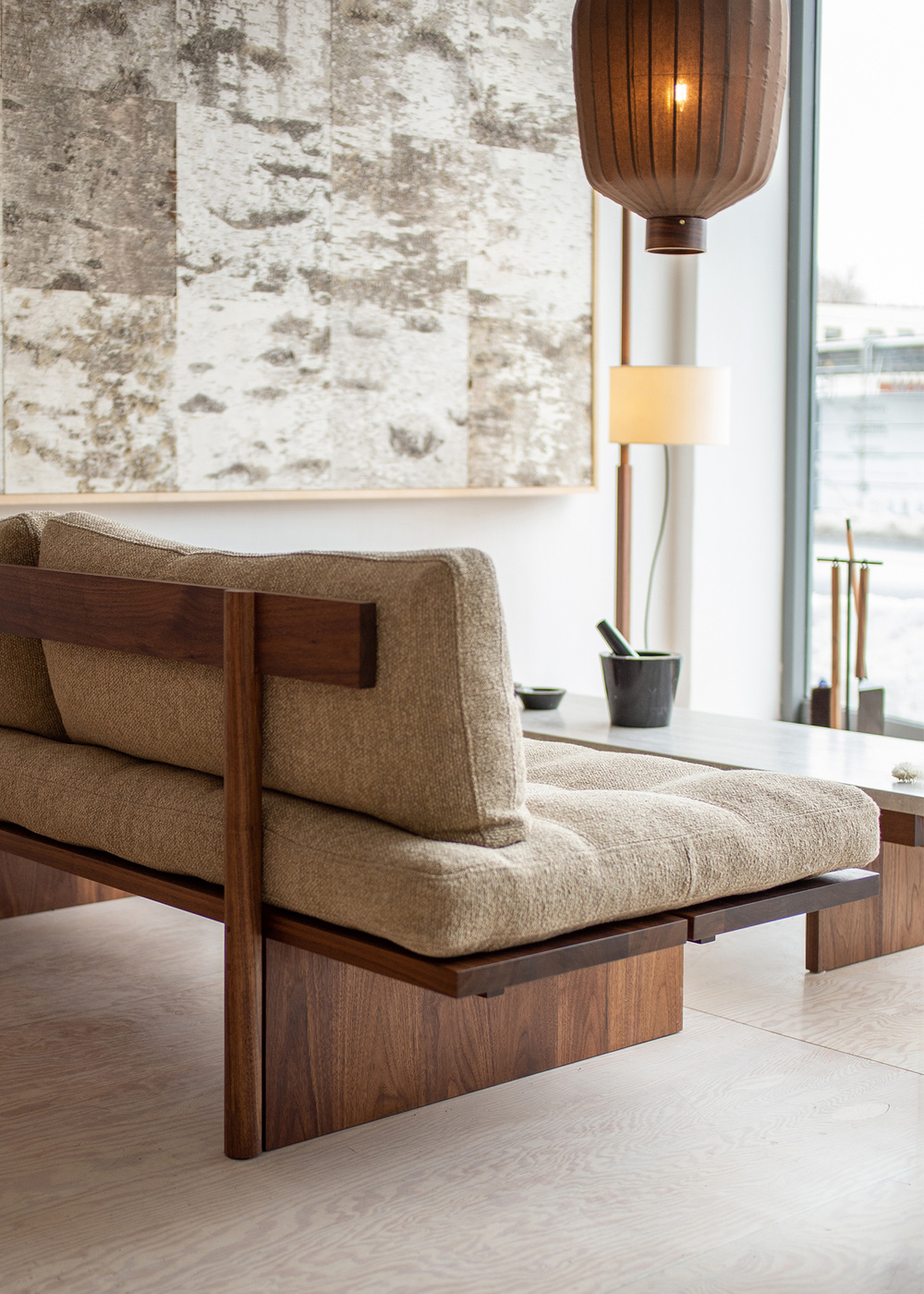 Orion armless teak sofa 3 seater with natural brown finish