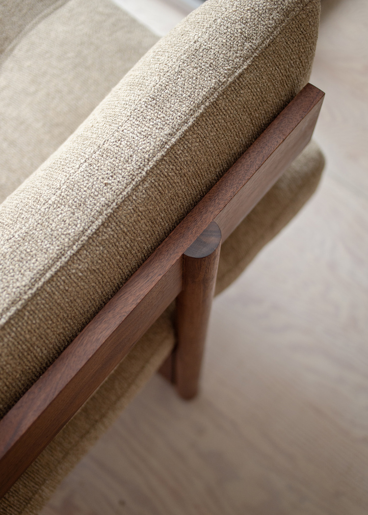 Orion armless teak sofa 3 seater with natural brown finish`