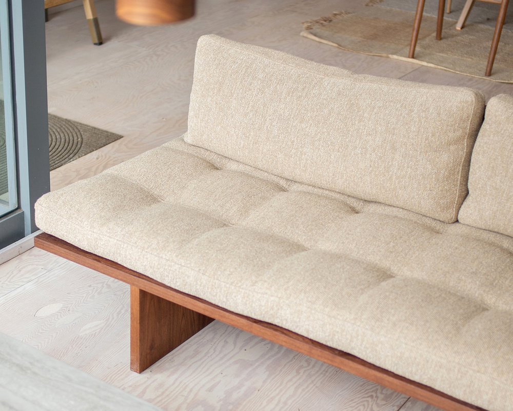 Orion armless teak sofa 3 seater with natural brown finish