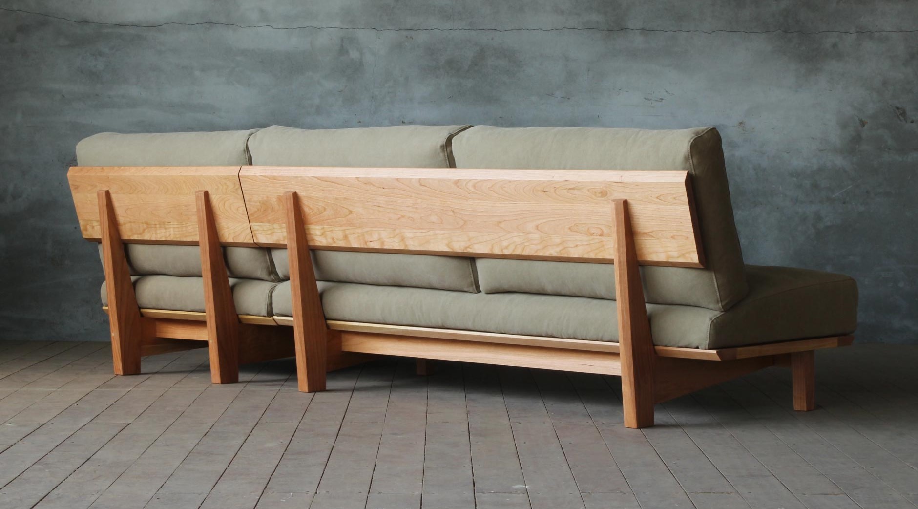 Arlo compact L shape sofa in teak wood with custom cushions
