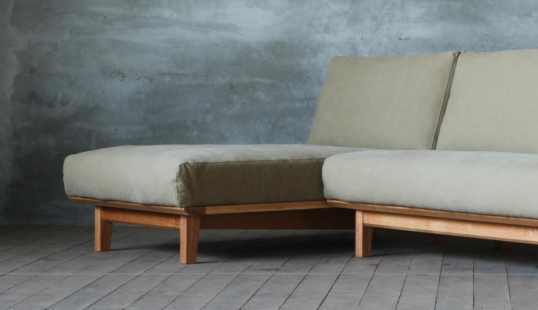 Arlo compact L shape sofa in teak wood with custom cushions