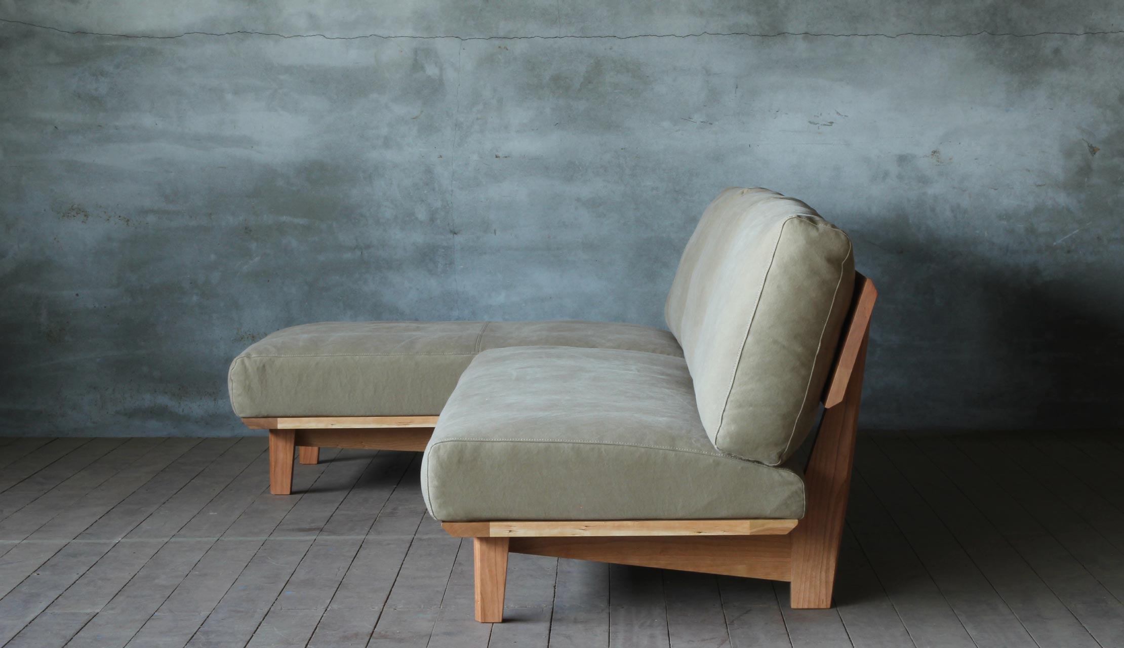 Arlo compact L shape sofa in teak wood with custom cushions