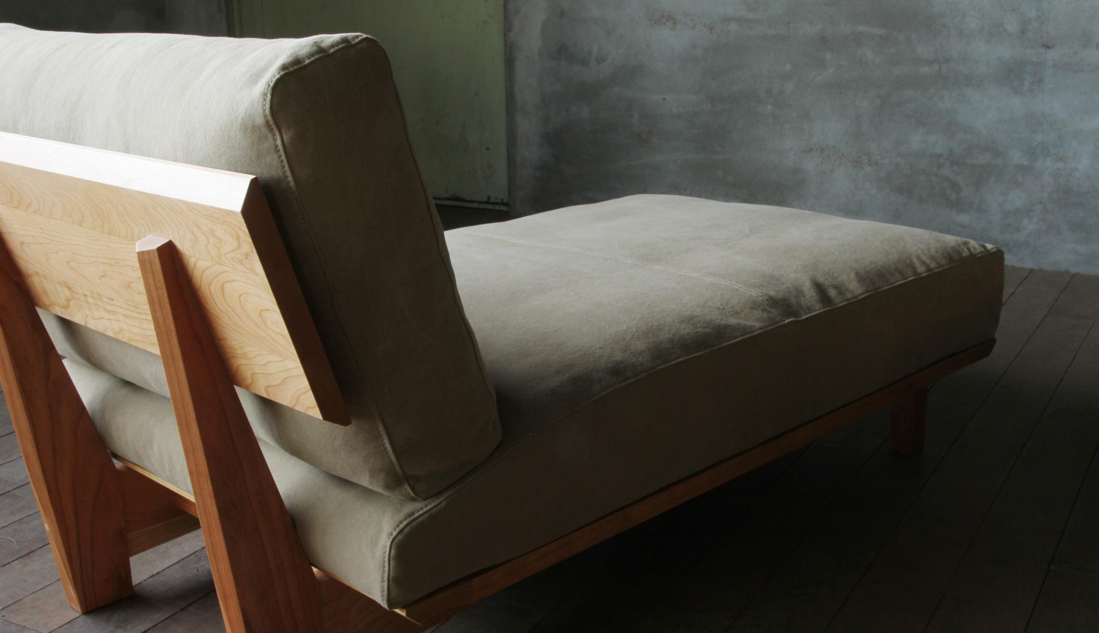 Arlo compact L shape sofa in teak wood with custom cushions