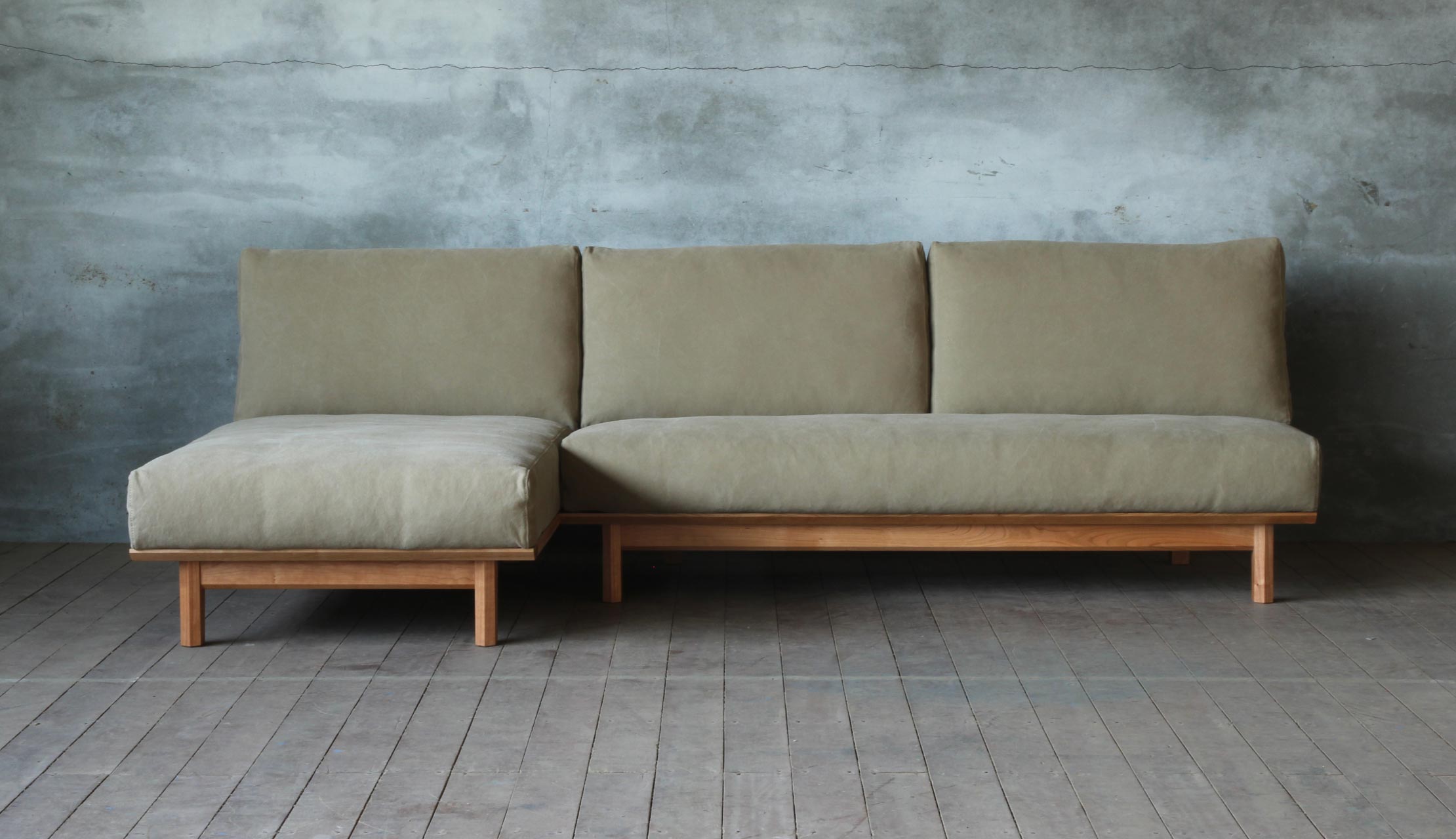 Arlo compact L shape sofa in teak wood with custom cushions