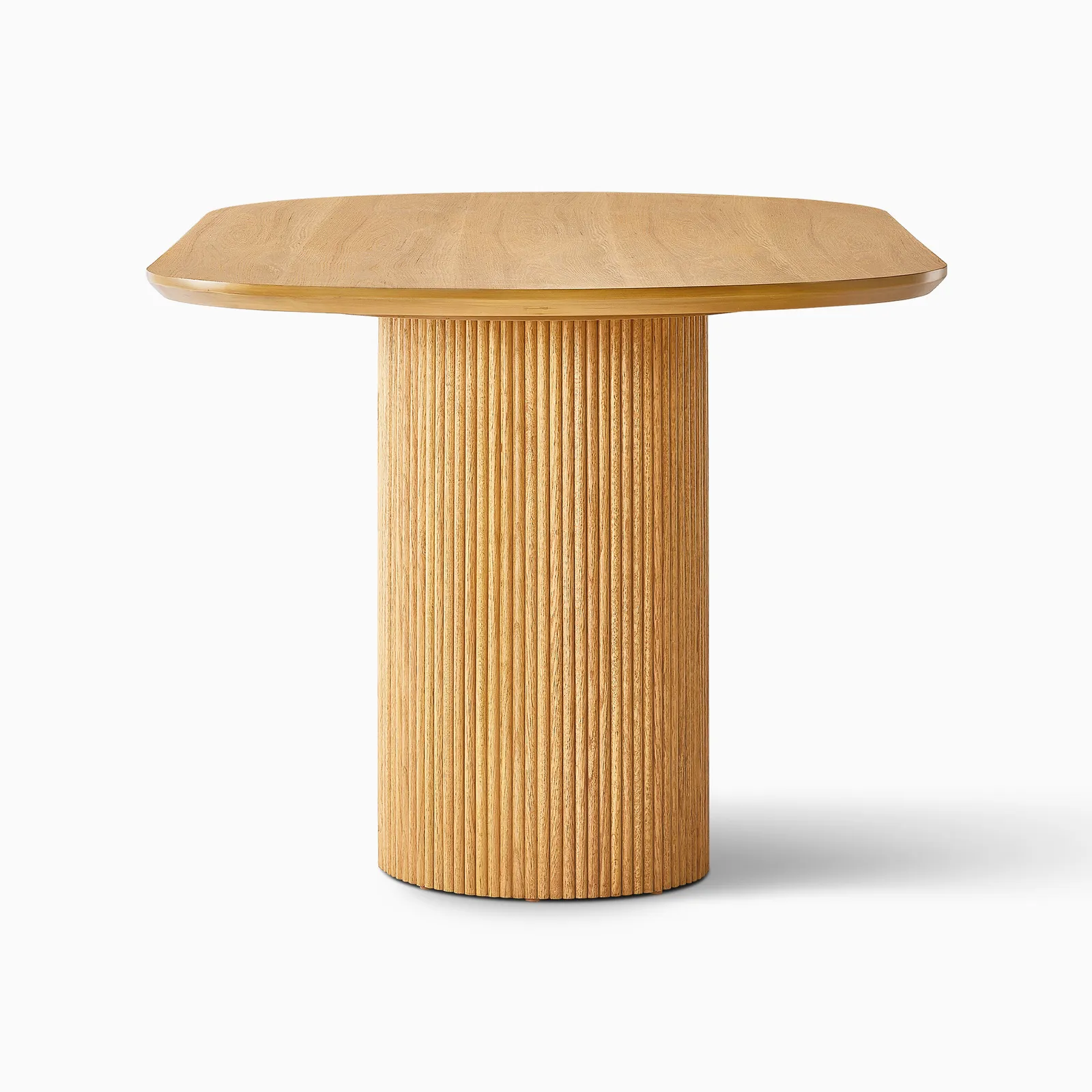 Curved dining table in teak wood with natural finish