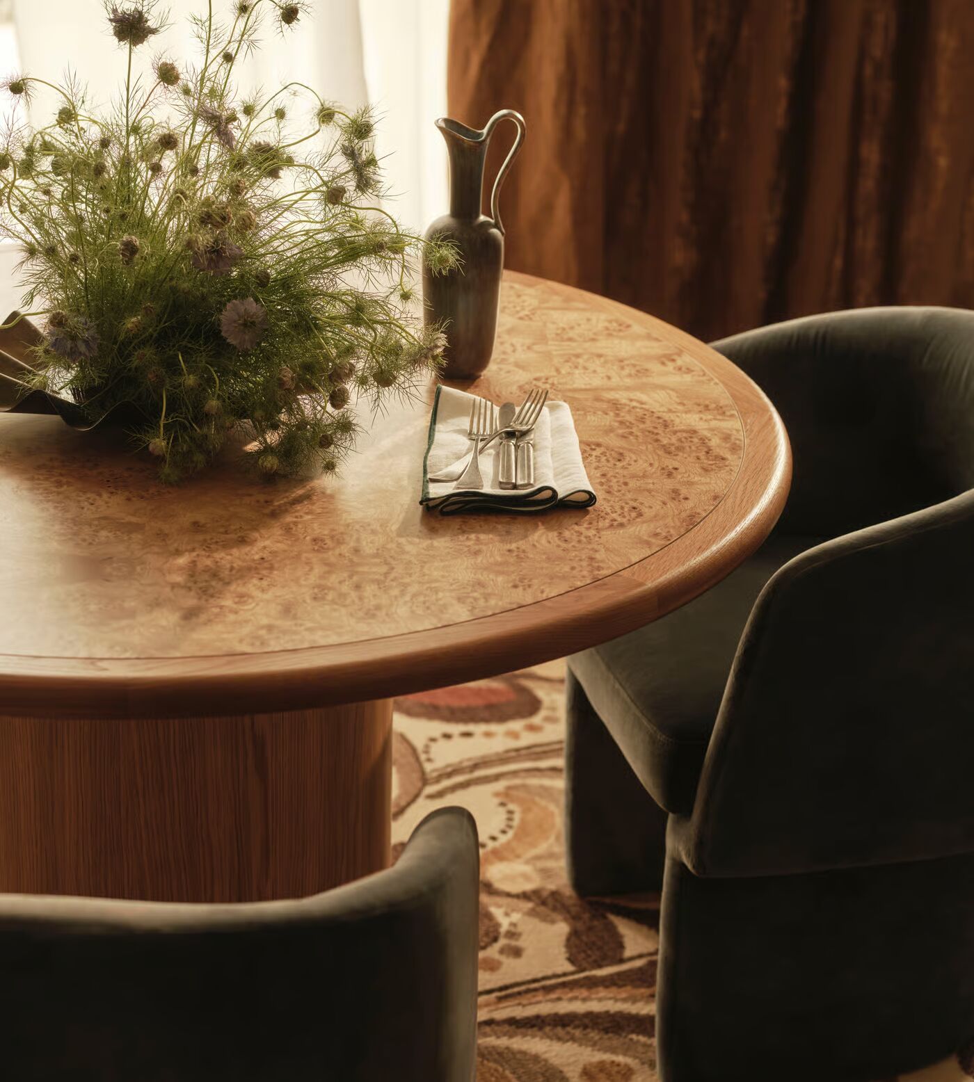 Round dining table in teak wood with brown finish