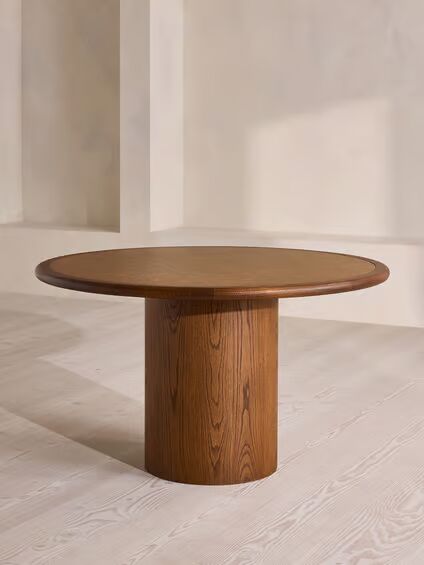 Round dining table in teak wood with brown finish