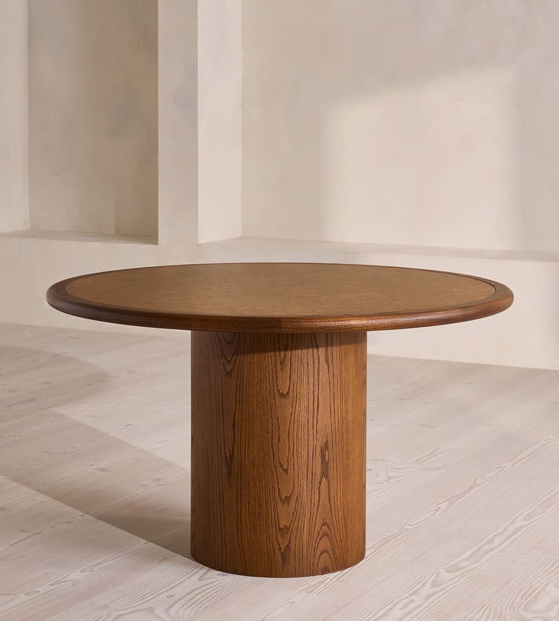 Round dining table in teak wood with brown finish