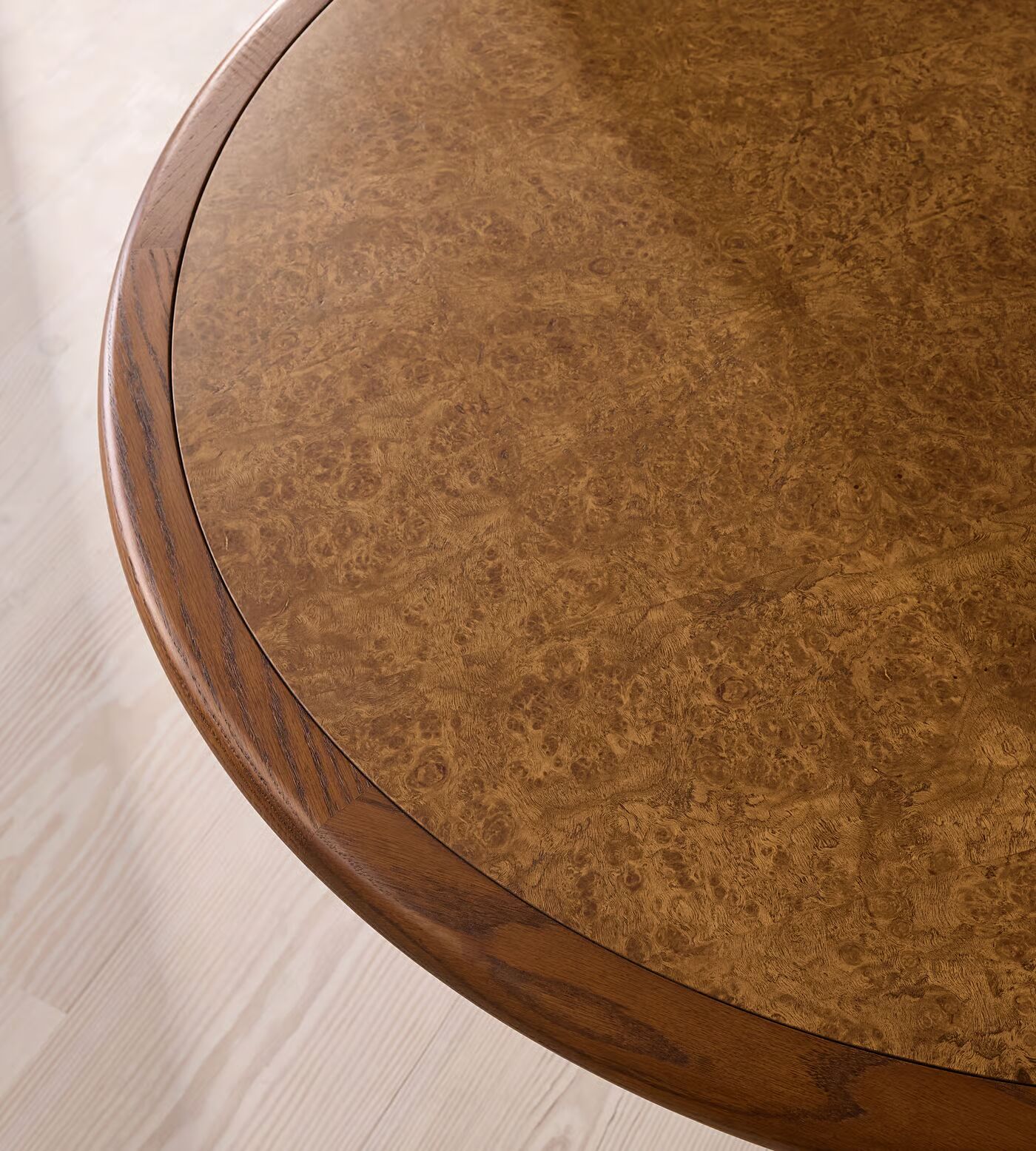 Round dining table in teak wood with brown finish