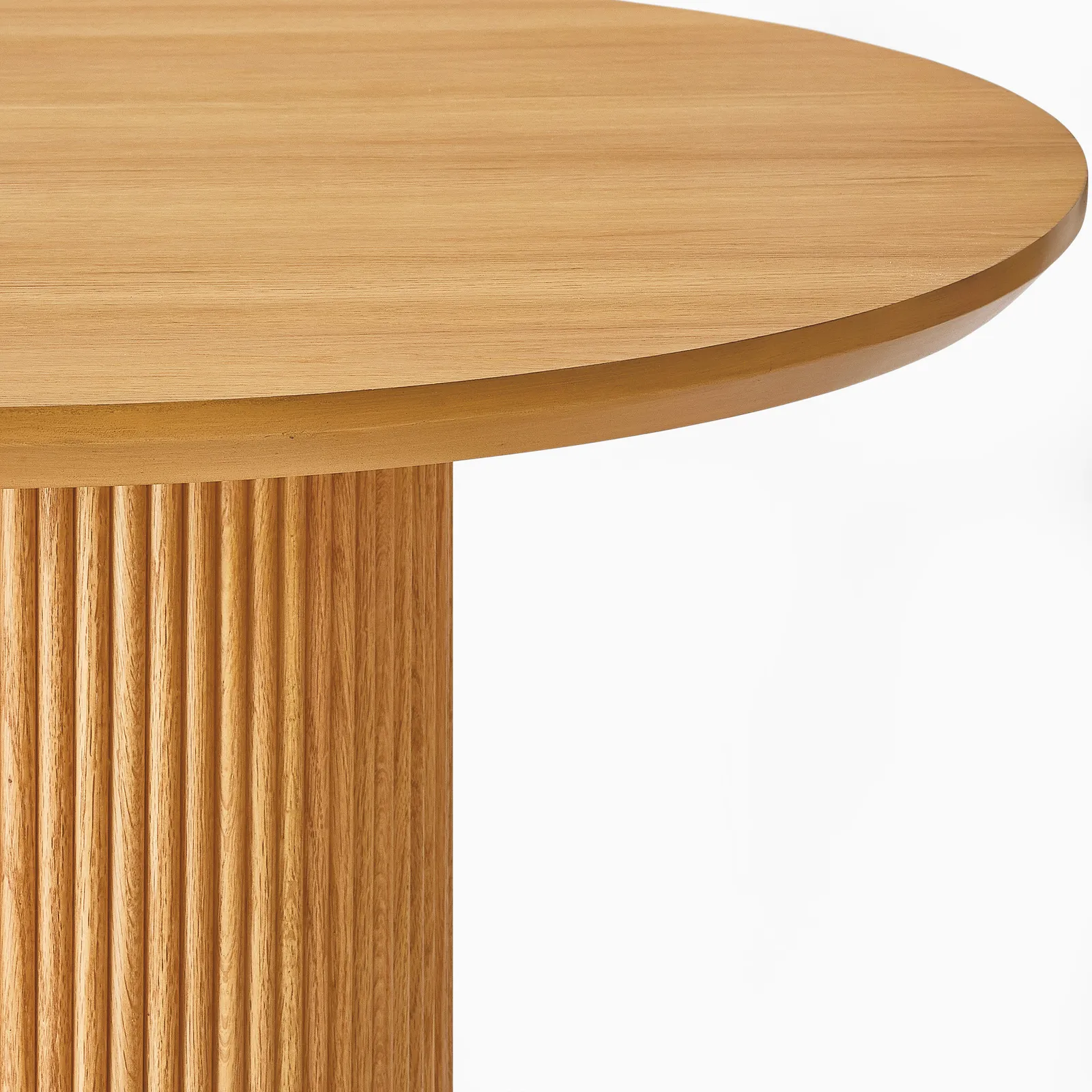 Curved dining table in teak wood with natural finish