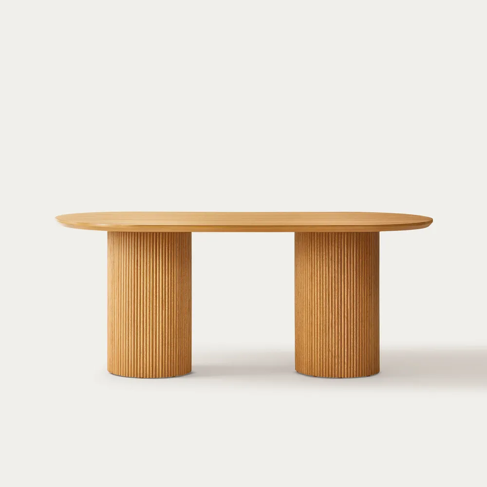 Curved dining table in teak wood with natural finish
