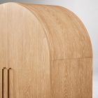 Arched wardrobe in teak wood with natural finish