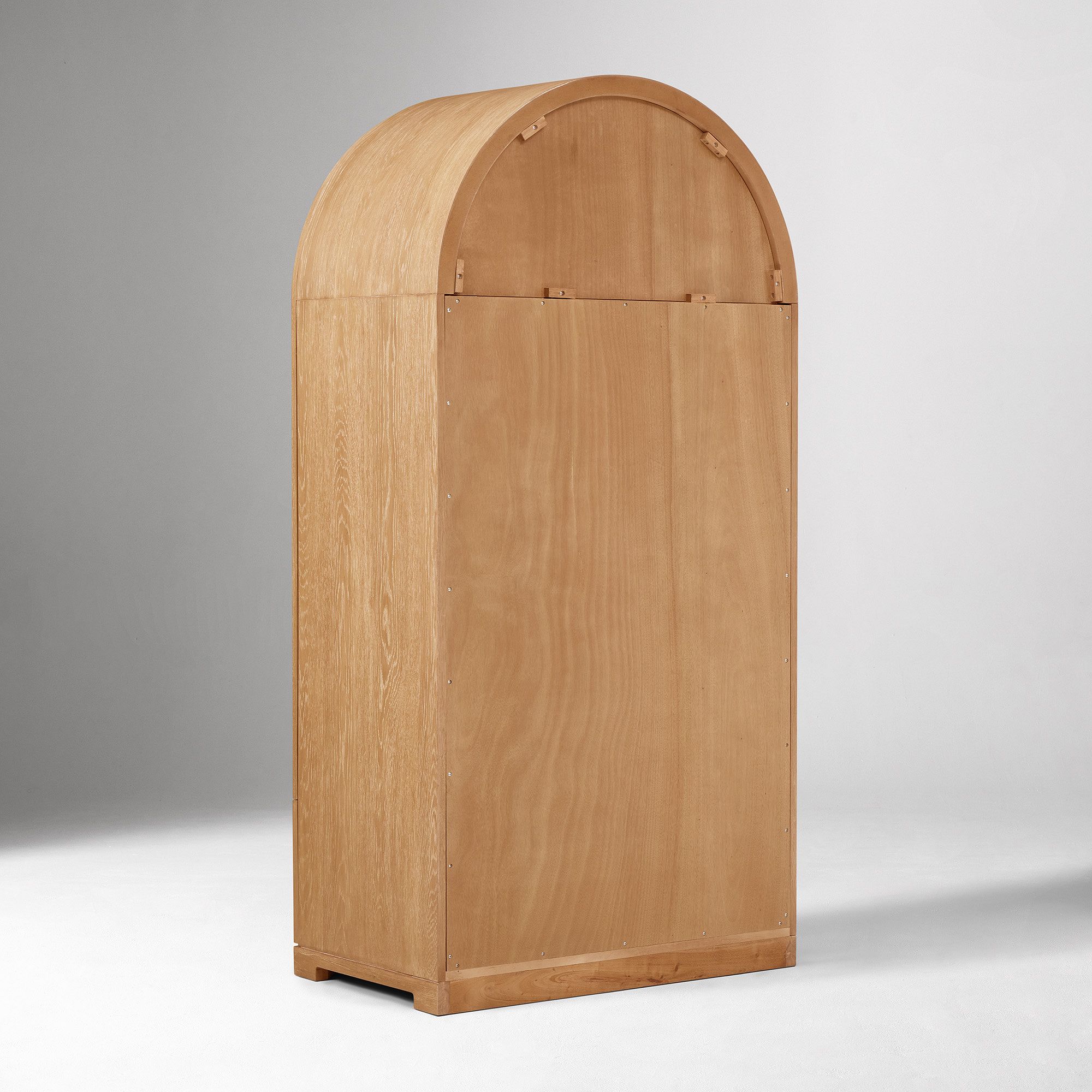 Arched wardrobe in teak wood with natural finish