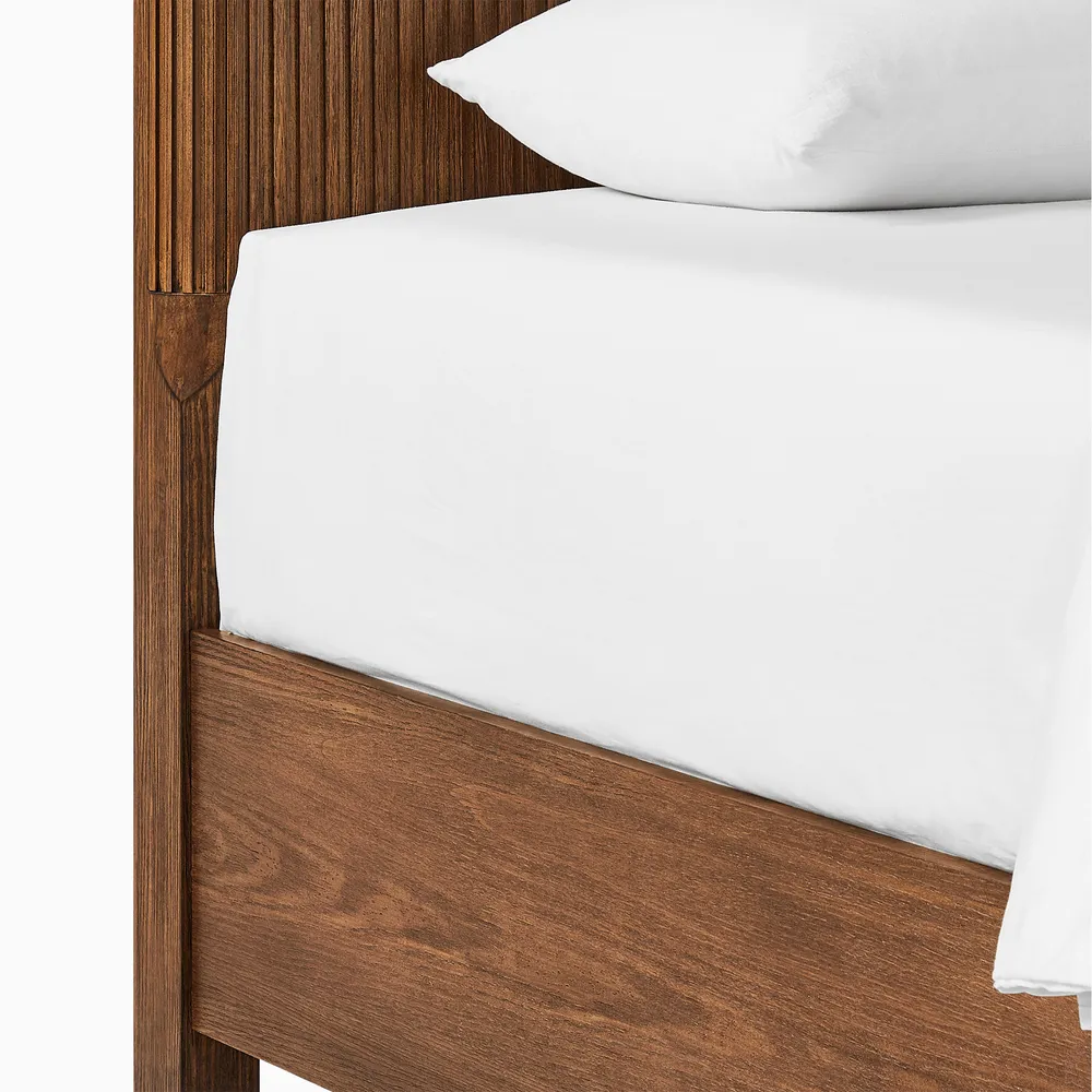 Eros wooden bed in teak wood with natural brown finish