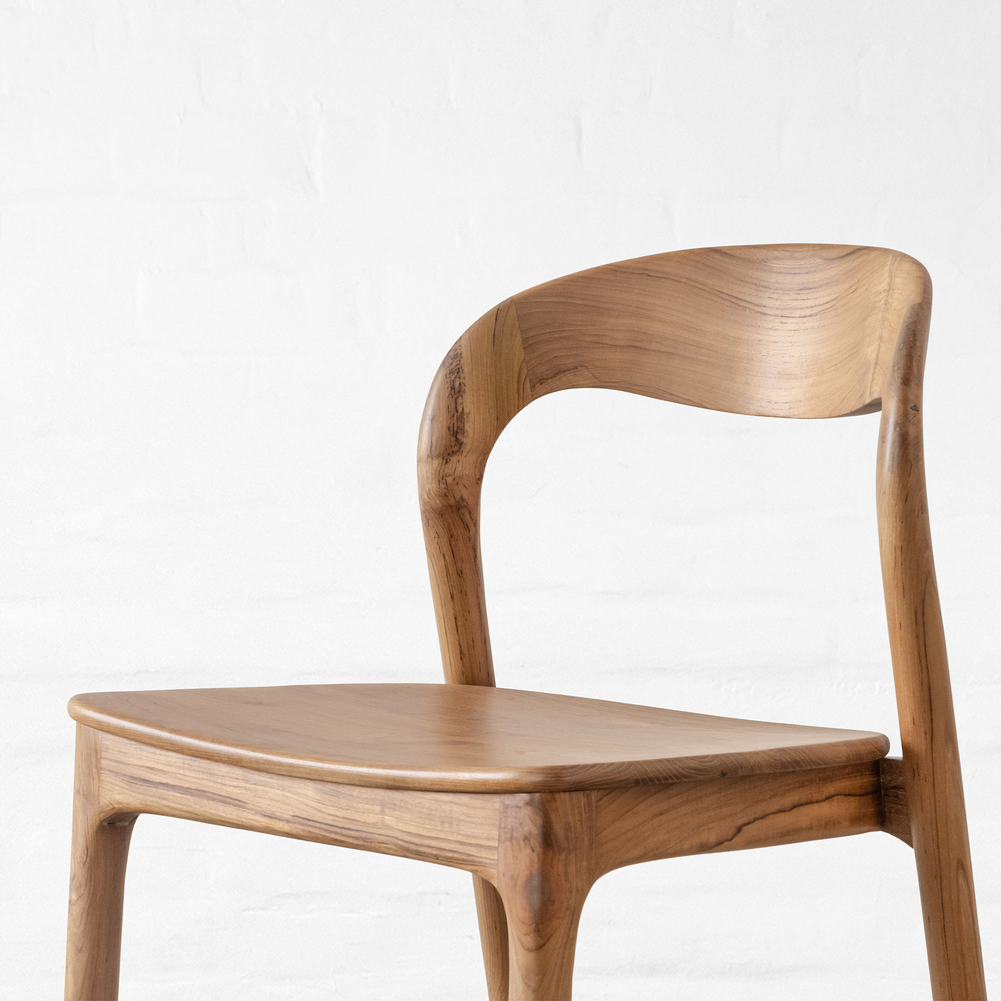 Premium dining table in teak wood with natural finish