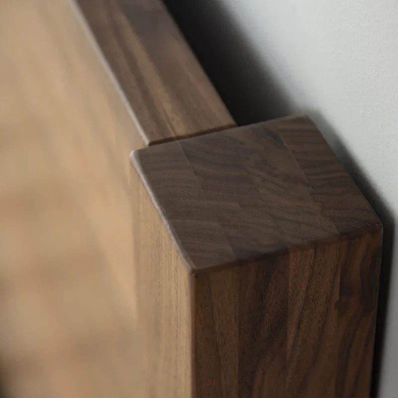 Aero wooden bed in teak wood with natural brown finish Aero wooden bed in teak wood with natural brown finish