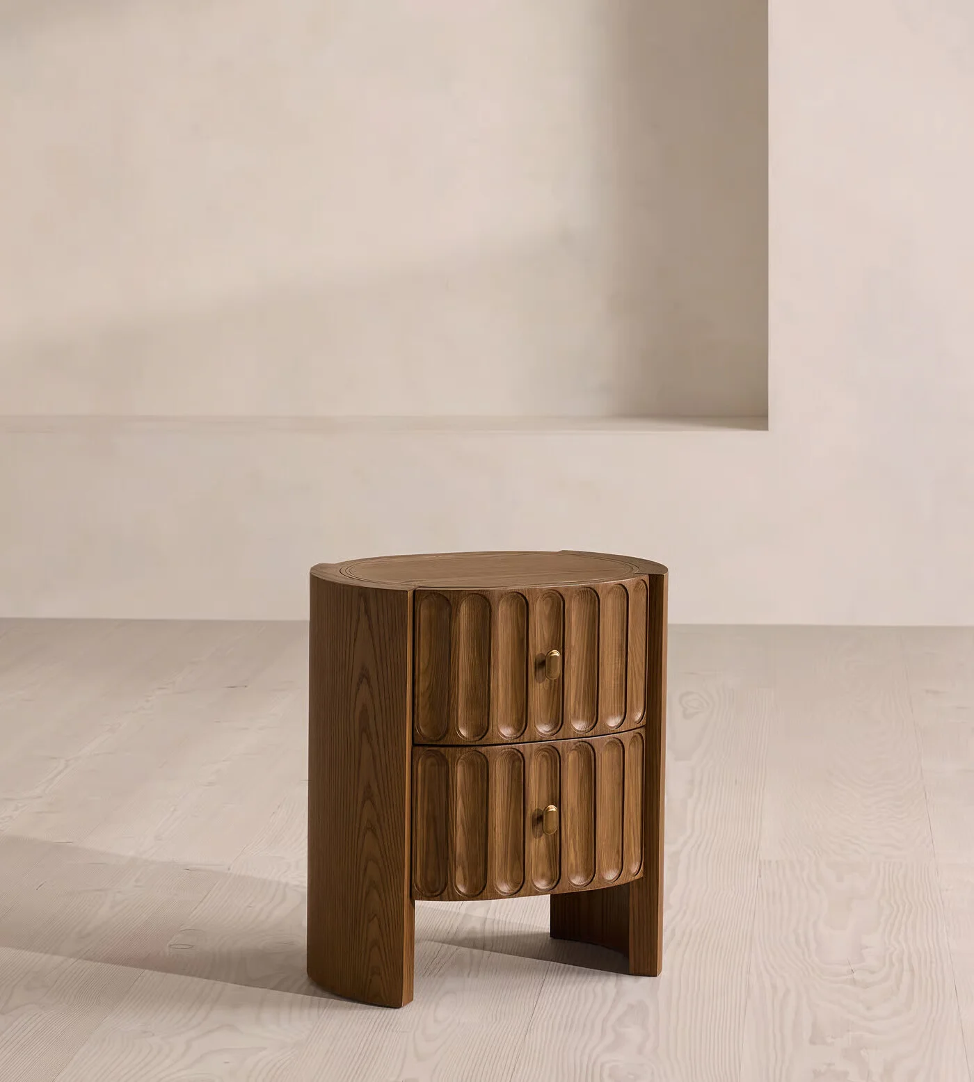 Night stand table with drawer in antique brass finish and pill-shaped grooves